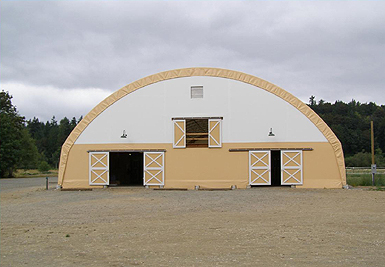 Patterson Creek riding arena end of structure showing doors.