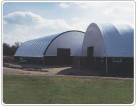 Outside View of Both Lang's Fabric Cover Arch Buildings - Commercial Equestrian Arena, & Stables