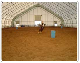 Inside the Erickson's Fabric Covered Rounded Peak Indoor Riding Arena